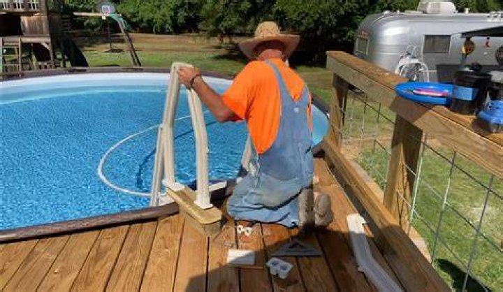 How do you attach a pool ladder to a deck?