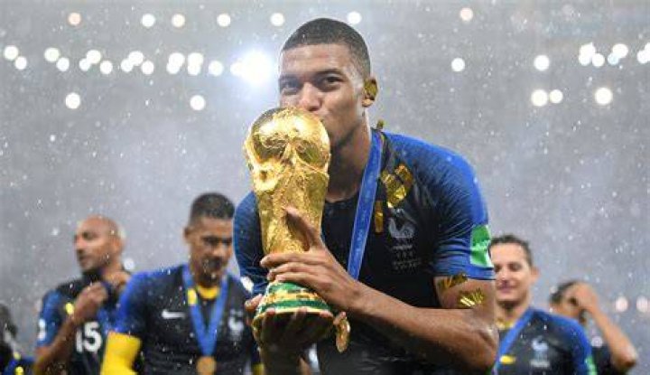 Kylian Mbappe with World Cup trophy