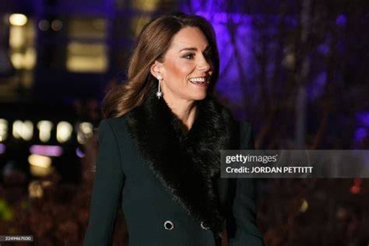 TOPSHOT - Britain's Prince Harry, Duke of Sussex and his wife Meghan, Duchess of Sussex emerge from the West Door of St George's Chapel, Windsor Ca...
